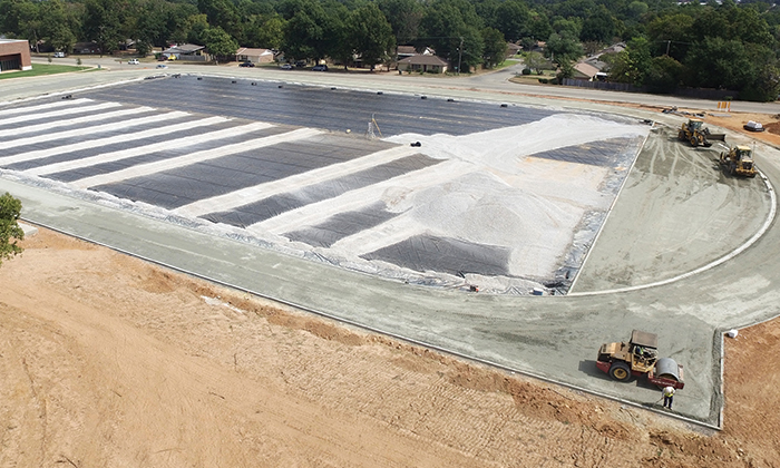 Running Track Construction - stone and asphalt base paving phase.